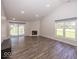 Spacious living room features a fireplace, hardwood floors and natural light at 3013 Crimson W Ct # 42, Carmel, IN 46033