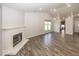 Open living space with fireplace, wood floors, and lots of natural light at 3013 Crimson W Ct # 42, Carmel, IN 46033