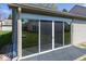 Enclosed patio featuring sliding screen doors and brick floor at 3013 Crimson W Ct # 42, Carmel, IN 46033