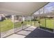 Enclosed sunroom with floor-to-ceiling windows providing backyard views at 3013 Crimson W Ct # 42, Carmel, IN 46033