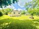 Spacious backyard with lush green lawn, fire pit and an additional building at 3201 N Hawthorne Ln, Indianapolis, IN 46218
