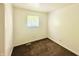 Neutral bedroom features neutral carpet, white walls, and a bright window at 3201 N Hawthorne Ln, Indianapolis, IN 46218