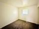 Bright bedroom boasts neutral carpet, white walls and ample natural light at 3201 N Hawthorne Ln, Indianapolis, IN 46218