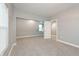 Bright bedroom features neutral walls, cozy carpeting, and a built-in niche, creating a serene retreat at 350 N Belleview Pl, Indianapolis, IN 46222