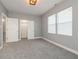 Bedroom with neutral carpet, paint, and trim, and an open closet off to the left at 350 N Belleview Pl, Indianapolis, IN 46222