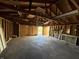 Unfinished garage ready for customization and featuring exposed wooden framing at 350 N Belleview Pl, Indianapolis, IN 46222