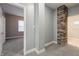 This hallway features new carpet, stone wall accent, and doorways to the bathroom and bedroom at 350 N Belleview Pl, Indianapolis, IN 46222