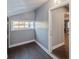 This hallway features new floors, a window, and doorways to other rooms at 350 N Belleview Pl, Indianapolis, IN 46222