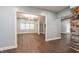 This living room features an open concept with new dark floors, and kitchen with stone wall accent at 350 N Belleview Pl, Indianapolis, IN 46222