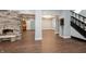 Living room with an easy flow to other areas and a stone fireplace at 350 N Belleview Pl, Indianapolis, IN 46222