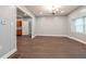 This living room features an open concept with new dark floors and overhead chandelier at 350 N Belleview Pl, Indianapolis, IN 46222