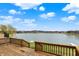 Inviting backyard with spacious deck and picturesque lake view at 4703 River Ridge Dr, Indianapolis, IN 46240