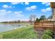 Enjoy lush lawn extending to the lake with dock from this backyard at 4703 River Ridge Dr, Indianapolis, IN 46240