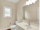 Half-bathroom with a white vanity and classic fixtures at 4703 River Ridge Dr, Indianapolis, IN 46240