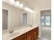 Bathroom featuring double vanity, a large mirror and updated fixtures at 4703 River Ridge Dr, Indianapolis, IN 46240