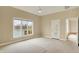 Spacious bedroom with neutral carpet, a ceiling fan, and a large window overlooking the lake at 4703 River Ridge Dr, Indianapolis, IN 46240