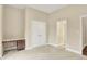 Neutral bedroom featuring a built-in desk, large closet, and open doorway at 4703 River Ridge Dr, Indianapolis, IN 46240