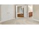 Spacious bedroom with wood floors, double closets, and bathroom access at 4703 River Ridge Dr, Indianapolis, IN 46240