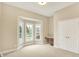 Bedroom with a bay window, built-in desk, and large closet at 4703 River Ridge Dr, Indianapolis, IN 46240