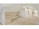Spacious room with built-in closet and neutral walls, leading to the bathroom at 4703 River Ridge Dr, Indianapolis, IN 46240