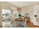 Charming breakfast nook has a round table, waterfront views, and stylish lighting at 4703 River Ridge Dr, Indianapolis, IN 46240