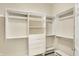 Bright walk-in closet with built-in shelving and ample storage at 4703 River Ridge Dr, Indianapolis, IN 46240