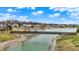 Scenic view of a community pathway with a charming bridge over a serene waterway at 4703 River Ridge Dr, Indianapolis, IN 46240