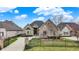 Charming brick home featuring a meticulously landscaped front yard and a private gated entrance at 4703 River Ridge Dr, Indianapolis, IN 46240
