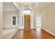 Inviting foyer with hardwood flooring, high ceilings, and a chandelier at 4703 River Ridge Dr, Indianapolis, IN 46240