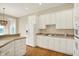 Bright kitchen with white cabinets, modern appliances, and ample counter space at 4703 River Ridge Dr, Indianapolis, IN 46240