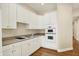 Bright kitchen featuring white cabinetry, countertops, and built-in oven microwave, perfect for modern living at 4703 River Ridge Dr, Indianapolis, IN 46240
