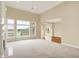 Bright living room with large windows, a fireplace, and beautiful views of the outdoor scenery at 4703 River Ridge Dr, Indianapolis, IN 46240