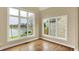 Light-filled living room with expansive windows offering picturesque views of the water at 4703 River Ridge Dr, Indianapolis, IN 46240
