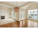 Open-concept living space with hardwood floors, a fireplace, and great natural light at 4703 River Ridge Dr, Indianapolis, IN 46240