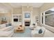 Bright living room features a fireplace, built-in shelves, and large windows with outdoor views at 4703 River Ridge Dr, Indianapolis, IN 46240