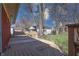 Wooden back deck with built in benches, offers a relaxing outdoor space surrounded by mature trees and landscaping at 4812 Eastgate Dr, Columbus, IN 47203