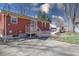 Backyard with a deck and patio, perfect for outdoor gatherings, along with mature trees and easy lawn access at 4812 Eastgate Dr, Columbus, IN 47203