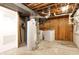Unfinished basement with hot water heater, washer and dryer hookups, ideal for laundry and utilities at 4812 Eastgate Dr, Columbus, IN 47203