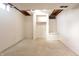 Unfinished basement offers a blank canvas for customization, featuring white walls and open ceiling at 4812 Eastgate Dr, Columbus, IN 47203