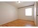 Empty bedroom featuring wood floors, bright white walls, and a window at 4812 Eastgate Dr, Columbus, IN 47203