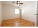 Bright bedroom with wood floors, neutral walls, and a ceiling fan at 4812 Eastgate Dr, Columbus, IN 47203