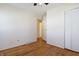 Spacious bedroom with wood floors, a ceiling fan, and a closet at 4812 Eastgate Dr, Columbus, IN 47203