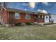 Charming single-story brick house with a cozy covered porch and established landscaping at 4812 Eastgate Dr, Columbus, IN 47203