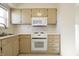 Kitchen featuring light wood cabinets, a stainless steel sink, and modern appliances at 4812 Eastgate Dr, Columbus, IN 47203