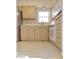 Kitchen with white appliances, and light colored cabinets at 4812 Eastgate Dr, Columbus, IN 47203