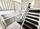 Open foyer with a staircase, modern railing, and views of the adjacent living spaces at 5608 Lunsford Dr, Indianapolis, IN 46237