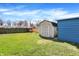 Two backyard sheds featuring a lush lawn and privacy fence at 5887 Meadowlark Dr, Indianapolis, IN 46226