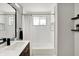Modern bathroom with a sleek vanity, updated shower, and contemporary fixtures at 5887 Meadowlark Dr, Indianapolis, IN 46226