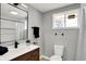 Updated bathroom featuring modern vanity, black hardware, and walk-in shower at 5887 Meadowlark Dr, Indianapolis, IN 46226