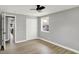 Bedroom featuring a ceiling fan, closet, neutral paint, and a window at 5887 Meadowlark Dr, Indianapolis, IN 46226